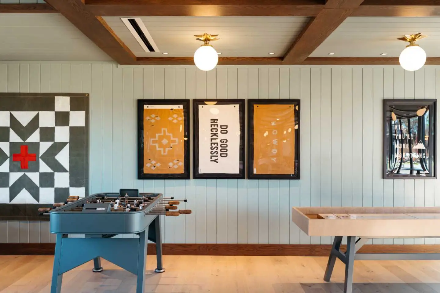A shuffleboard and foosball table at The Pier