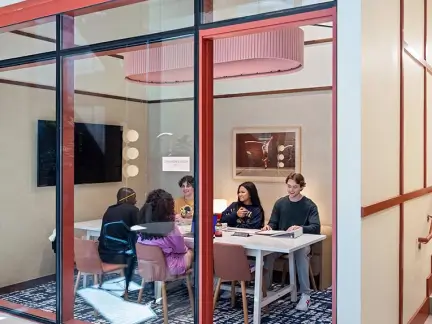 residents working in an enclosed study room