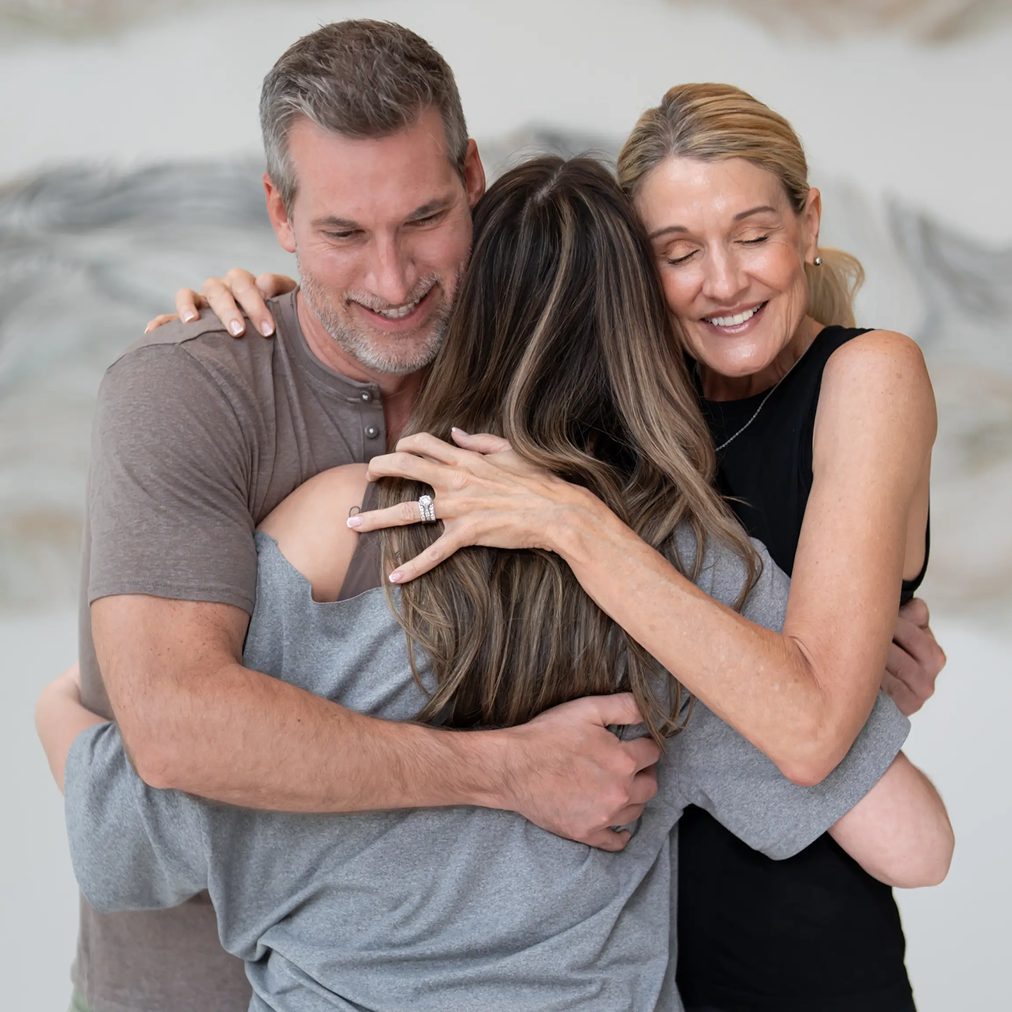 hugging family